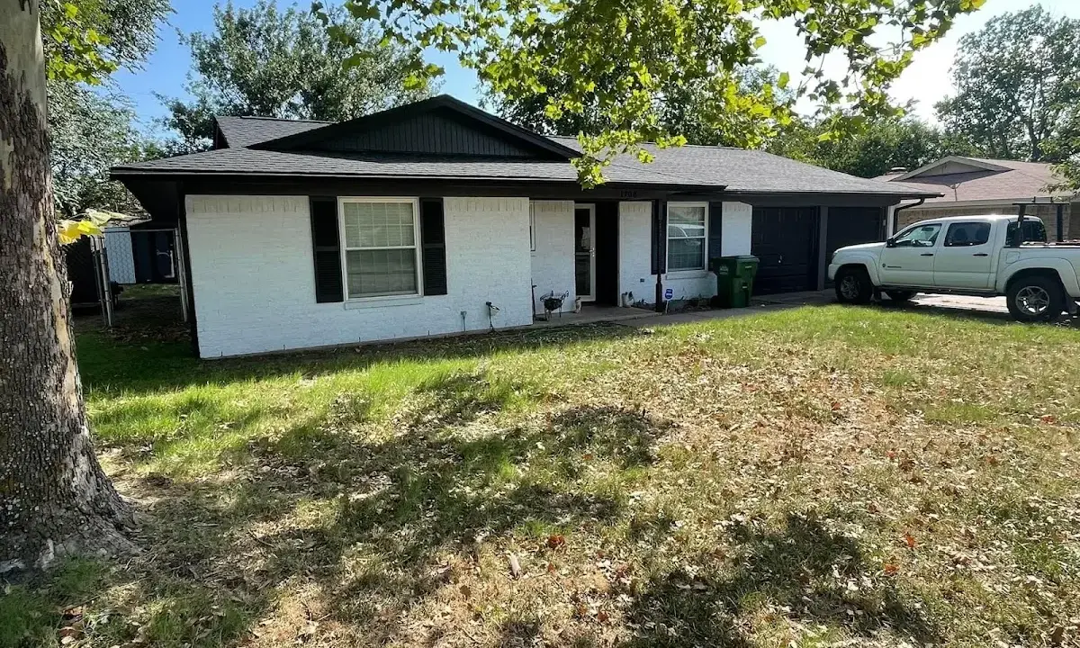 Professional roofing crew working on a residential roof in Bethesda
